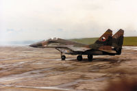 9207 @ EGVA - Czech Air Force MiG-29A Fulcrum preparing to join the active runway at the 1993 Intnl Air Tattoo at RAF Fairford. The visible spray will remind all those who were there of the weather conditions. - by Peter Nicholson