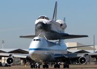 N911NA @ BAD - Taxiing to Runway 33 with the Space Shuttle Endeavour on its back. They stopped at Barksdale and spent the night on the return trip back to Florida. - by paulp