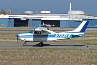 N732KE @ KCCR - Central Valley-based Cessna T210L taxis for take-off on RWY 1L with Concord Jet hangers and tank farm in background @ Buchanan Field, Concord, CA - by Steve Nation