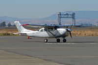 N8394Z @ KAPC - Brushed silver 1963 Cessna 210-5(205) with Napa River RR Bridge in background visiting from South County Airport/San Martin, CA @ Napa County Airport, CA - by Steve Nation