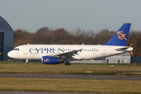 5B-DCF @ EGCC - Cyprus Airways A319 taxing to RW05L - by Chris Hall