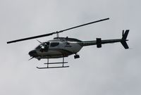 N206HM - Orange County Sheriff OH-58C.  Circling over my apartment complex after a bank robbery down the street in Orlando - by Florida Metal