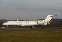 N516GH @ EGGW - Gulfstream V touching down on RW26 - by Chris Hall