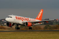 G-EZAC @ EGGW - easyJet A319 landing on RW26 - by Chris Hall