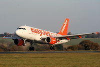 G-EZAW @ EGGW - easyJet A319 landing on RW26 - by Chris Hall