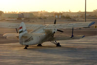 HA-MBG @ HELX - Surprise to find this AN-2R on the Luxor Ramp - photo through plane window whilst taxying in
