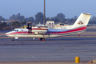 SU-CBA @ HELX - Petroleum Air Sevices 1983 De Ha DHC-7-102, c/n: 93 - taken through the window of the Monarch 
A300 on arrival