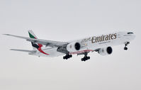 A6-ECP @ EHAM - Emirates 777 landing on 36R out of the Fog - by Jan Lefers