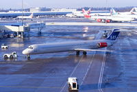 LN-RLF @ EGCC - Scandinavian MD-82 pushing back from its gate - by Chris Hall