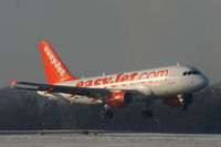 G-EZGC @ EGCC - easyJet A319 landing on RW05L - by Chris Hall