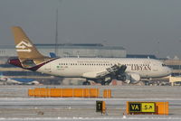 5A-LAH @ EGCC - Libyan Airways A320 landing on RW05L - by Chris Hall