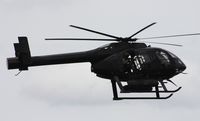 N810LA @ LAL - Blackwater Security trying to intimidate airshow fans by pointing gun from chopper to crowd - by Florida Metal