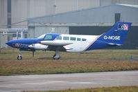 G-NOSE @ EGNX - 1975 Cessna CESSNA 402B, c/n: 402B-0823 at East Midlands - by Terry Fletcher