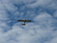 N28820 @ SZP - 1987 Christen A-1 HUSKY, Lycoming O&VO-360 180 Hp, banner tow pickup Rwy 04R, look closely to see the towline - by Doug Robertson