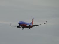 N399WN @ ONT - All lights on and on final to runway 26R on a cold drizzly day - by Helicopterfriend