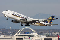 9V-SPN @ LAX - Singapore Airlines 9V-SPN (FLT SIA11) climbing out from RWY 25R en route to Narita Intl (RJAA). Now with large titles. - by Dean Heald