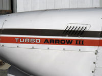 N38704 @ SZP - 1977 Piper PA-28R-201T TURBO ARROW III, Continental TSIO-360-F 200 Hp, logo - by Doug Robertson