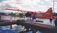 N68083 - Ladd Heldenbrand, my father, inspecting our Rust's Beaver. From Anchorage to see Denali, the last week of August 2000. Never to be forgotten, a glorious flight. - by Nan Heldenbrand Morrissette