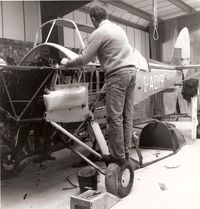 G-AOIR - G-AOIR at Meppershall, when operated by The Stevenage Flying Group. A steel framed cabin had just been fitted to replace the rapidly deteriorating wooden original. Les Smith, who later purchased the aircraft, is working on the fuselage. - by Lee Mullins