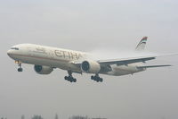 A6-ETC @ EGCC - Etihad Airways coming through the fog on approach to RW23R - by Chris Hall