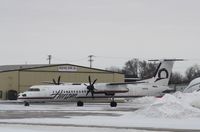 N415QX @ KRFD - DHC-8-400 - by Mark Pasqualino