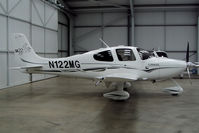 N122MG @ EGBT - Parked in Cirrus hangar - by N-A-S