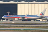 N381AN @ KLAX - American Airlines Boeing 767-323, getting a tow to the AA maintenance hangar at KLAX. - by Mark Kalfas