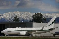 N50TC @ VNY - At Van Nuys today with the snow, in the moutains, in the background. - by Bernard Falkin