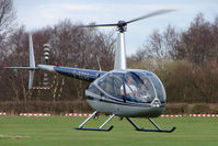 G-BZGO @ EGCB - 2000 Robinson R44 Astro, c/n: 0757 at City of Manchester Airport - by Terry Fletcher
