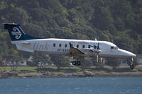 ZK-EAE @ NZWN - into a blustery Welly wind - by Bill Mallinson