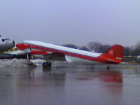 N115Z @ KOSH - Taken on a heavy rain day at Basler Turbo Conversions - by steveowen