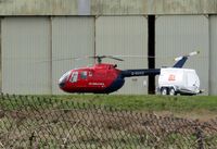 G-BUXS @ EGFH - Spare helicopter standing in for the regular Swansea based Wales Air Ambulance G-WASN. - by Roger Winser