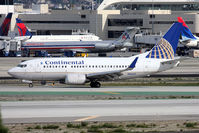 N16647 @ LAX - Continental Airlines N16647 (FLT COA195) on Taxiway Hotel after arrival from Houston Bush Intercontinental (KIAH) on RWY 25L. The Continental 737-500s are rare visitors to KLAX and will become even more rare. - by Dean Heald
