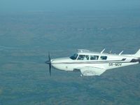 5R-MDV @ FMNN - Piper Comanche 260B 5R-MDV over Madagascar west coast shore. - by Gauthier ISMAIL