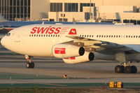 HB-JMO @ KLAX - Swiss Airbus A340-313, SWR40 arriving from LSZH (Zurich-Kloten), turning onto TWY P KLAX. - by Mark Kalfas