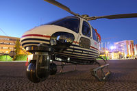 D-HHLM @ 0000 - Linz Marathon Heli,
parked in front of the Design Center - by Peter Pabel