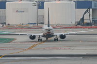 N305AW @ KLAX - US AIRWAYS Boeing 737-3G7, AWE543 arriving from KLAS, on TWY T KLAX. - by Mark Kalfas