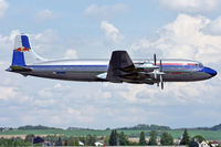 N996DM @ LOWL - Red Bull Douglas DC-6B over RWL08 in LOWL/LNZ - by Janos Palvoelgyi