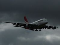 VH-OQE @ YMML - Oscar Quebec Echo arriving at Tullamarine under ominous skies. - by red750