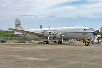 128424 @ NPA - 1951 Douglas C-118, c/n: 43207 in outside storage at Pensacola Naval Museum