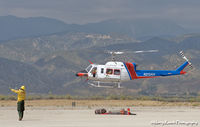 N212AH @ REI - Departing to drop off firefighters. - by Marty Kusch