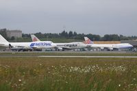 B-18707 @ ELLX - Left side of the cargo tarmarc with B-18707,LX-SCV,TF-NAC and the tiny G-BTPH - by Raybin