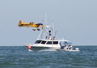 N580GP - Chapman buzzing a boat - by Florida Metal