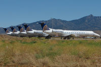 N25504 @ IGM - 1999 Embraer EMB-135ER, c/n: 145186 heads a line of ex CO ERJ135s stored at Kingman - by Terry Fletcher