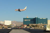 N288DP @ LAS - Janet Airlines' Boeing 737-66N, c/n: 29892 crosses Tropicana Avenue heading for Runway 19 landing at Las Vegas - by Terry Fletcher