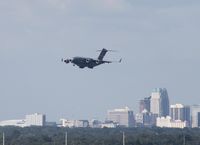 06-6162 @ MCO - C-17 on approach into MCO with downtown Orlando in background - by Florida Metal