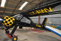 LY-AWV @ EGAD - Parked in the hangar - by Robert Kearney
