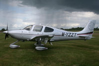 M-YZZT @ EGBT - With a passing shower behind - by N-A-S