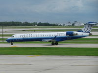 N154GJ @ ORD - United Express Bombardier CL-600-2C10 taxiing at Chicago O'hare Airport. - by David Burrell