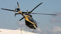 N330BC - Bell 407 leaving Heliexpo Orlando - by Florida Metal